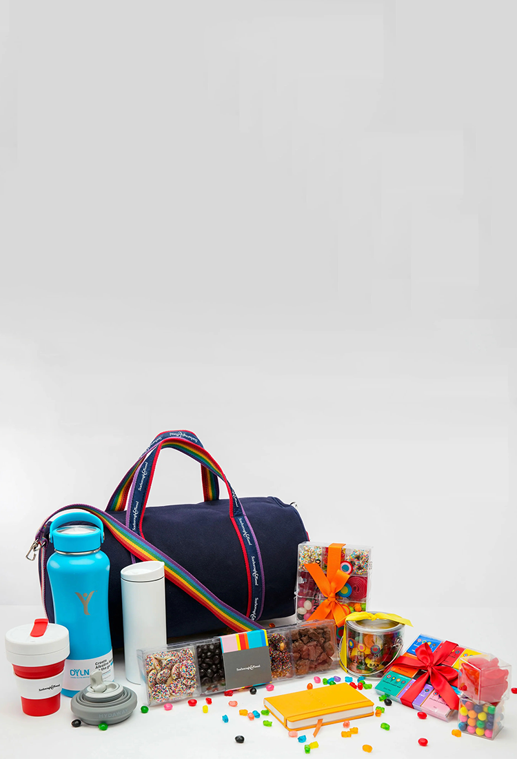 Colorful gift set with duffle banker bag, water bottles, snacks, and candies