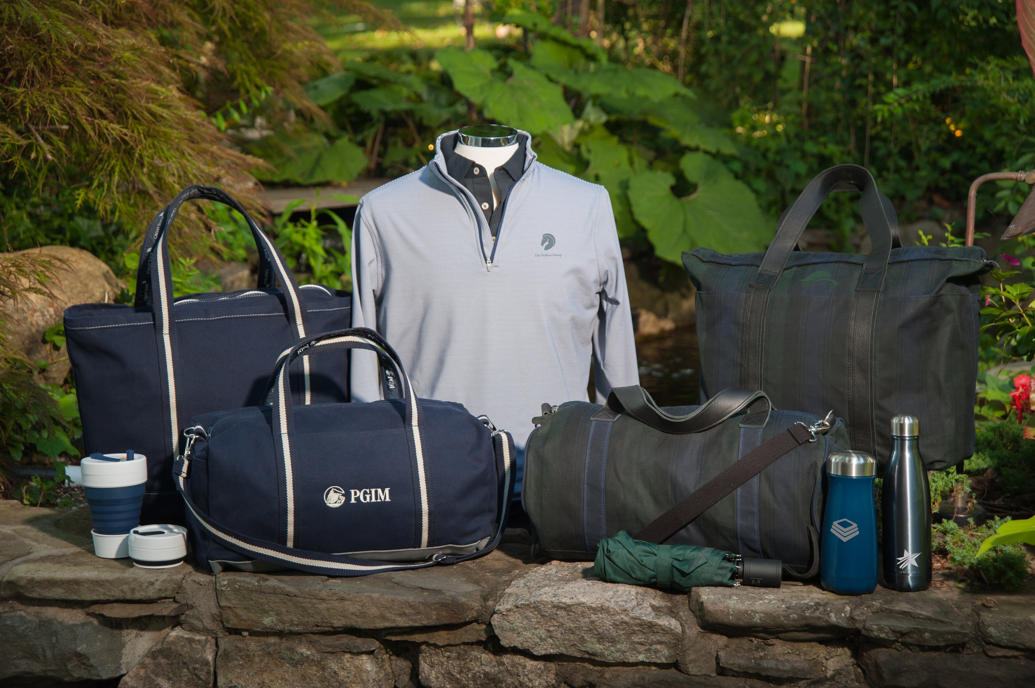 Custom corporate gifts including banker bags, bottles, and apparel.