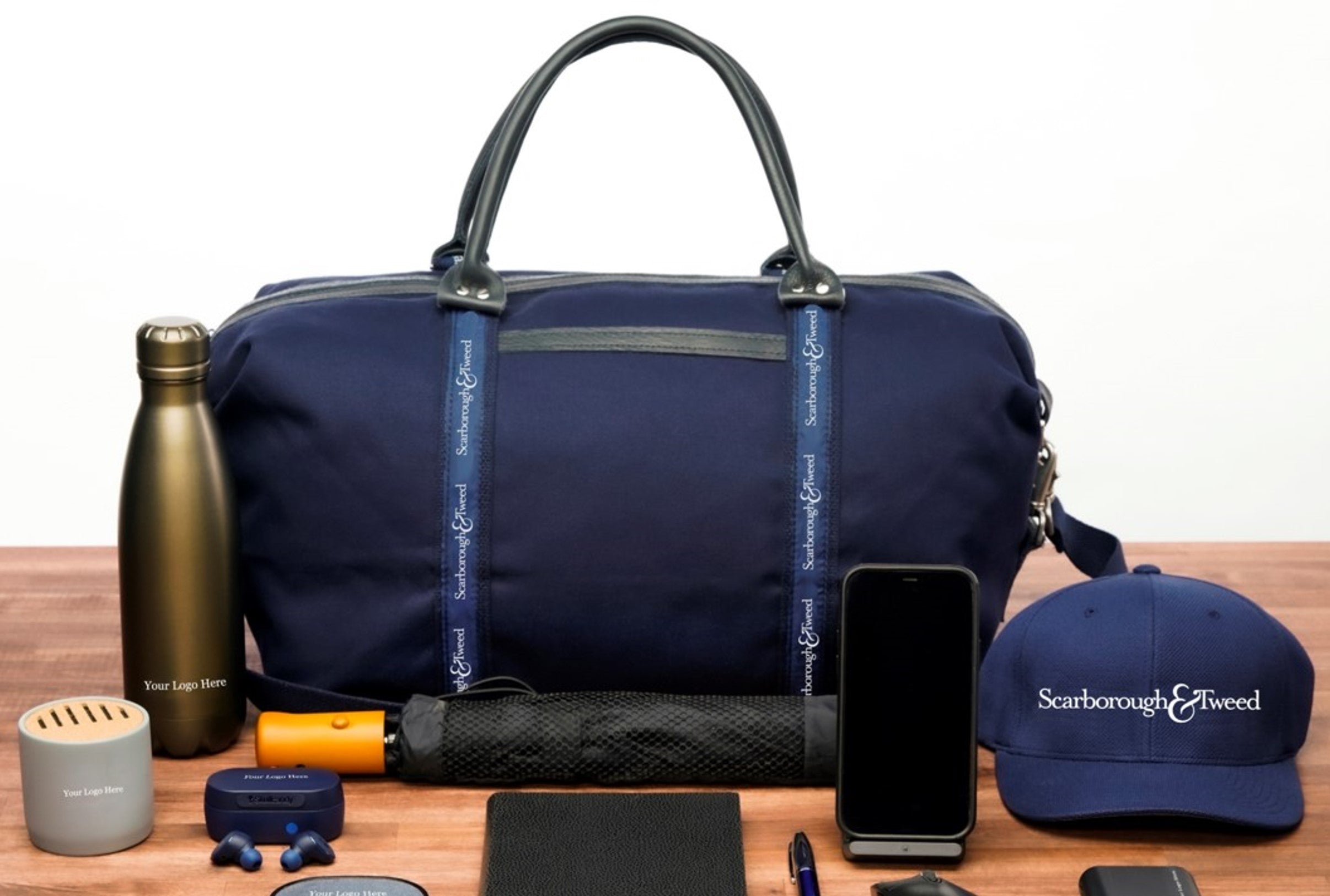 Branded corporate gift set with bag, bottle, and accessories.