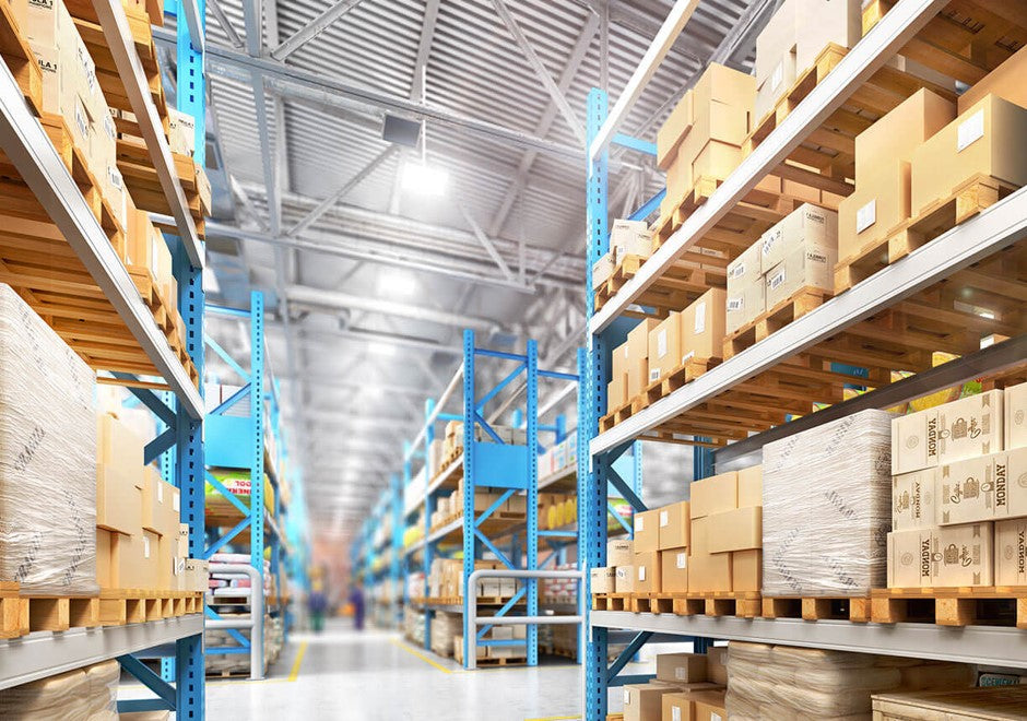 Warehouse with shelves of cardboard boxes.